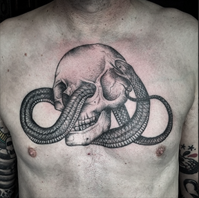 Rebecca Vincent Tattoo. Snake skull tattoo chest piece. Parliament Tattoo London.